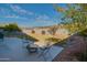 Spacious backyard with grass, fire pit, and patio at 4872 E Sandwick Dr, San Tan Valley, AZ 85140