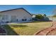 Large backyard with grassy area and brick walkway at 4872 E Sandwick Dr, San Tan Valley, AZ 85140