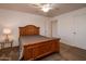 Bedroom with wood bed frame and ceiling fan at 4872 E Sandwick Dr, San Tan Valley, AZ 85140