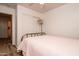 Bedroom with pink bedding and access to bathroom at 4872 E Sandwick Dr, San Tan Valley, AZ 85140