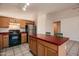 Kitchen with island, stainless steel appliances, and wood cabinets at 4872 E Sandwick Dr, San Tan Valley, AZ 85140