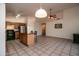 Open kitchen with island and breakfast bar, stainless steel appliances, and wood cabinets at 4872 E Sandwick Dr, San Tan Valley, AZ 85140