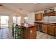 Kitchen with island, stainless steel appliances, and wood cabinets at 4872 E Sandwick Dr, San Tan Valley, AZ 85140