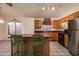 Kitchen with island, stainless steel appliances, and wood cabinets at 4872 E Sandwick Dr, San Tan Valley, AZ 85140