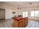 Kitchen with island, ceiling fan and wood cabinets at 4872 E Sandwick Dr, San Tan Valley, AZ 85140