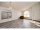 Living room with wood-look floors, high ceilings, and a chandelier at 4872 E Sandwick Dr, San Tan Valley, AZ 85140