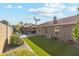Landscaped backyard with grassy area and a view of the home's exterior at 500 E Encinas Ave, Gilbert, AZ 85234