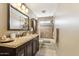 Bathroom with granite vanity, shower/tub combo, and tile flooring at 500 E Encinas Ave, Gilbert, AZ 85234