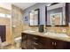 Double vanity bathroom with granite countertops and a large shower at 500 E Encinas Ave, Gilbert, AZ 85234