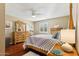 Bedroom with wood floors, queen bed, and wood dresser at 500 E Encinas Ave, Gilbert, AZ 85234