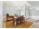 Bright dining area with chandelier and hardwood floors at 500 E Encinas Ave, Gilbert, AZ 85234