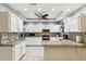 Updated kitchen with white cabinets, granite countertops and breakfast bar at 500 E Encinas Ave, Gilbert, AZ 85234