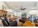 Comfortable living room featuring hardwood floors and large TV at 500 E Encinas Ave, Gilbert, AZ 85234