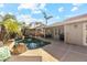 Expansive pool area, patio furniture, and a built-in grill at 500 E Encinas Ave, Gilbert, AZ 85234