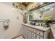 Double vanity bathroom with granite countertops and plenty of plants at 5301 E Mitchell Dr, Phoenix, AZ 85018