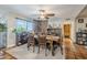 Charming dining area with brick accent wall and rustic wooden table at 5301 E Mitchell Dr, Phoenix, AZ 85018