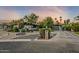 Beautiful mid-century modern home with landscaped front yard and long driveway at 5301 E Mitchell Dr, Phoenix, AZ 85018