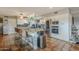 Modern kitchen featuring white cabinets, granite countertops, and a large island at 5301 E Mitchell Dr, Phoenix, AZ 85018