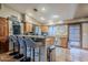Kitchen with wood cabinets, granite countertop, and breakfast bar at 5301 E Mitchell Dr, Phoenix, AZ 85018
