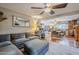 Comfortable living room featuring a sectional sofa and view into the dining area at 5301 E Mitchell Dr, Phoenix, AZ 85018
