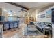 Open living space with a sectional sofa, coffee table, and kitchen bar at 5301 E Mitchell Dr, Phoenix, AZ 85018
