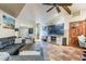 Cozy living room with sectional sofa, large TV, and plenty of natural light at 5301 E Mitchell Dr, Phoenix, AZ 85018