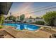 Inviting swimming pool with a diving board and surrounding patio at 5301 E Mitchell Dr, Phoenix, AZ 85018