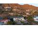 View of home with pool on hillside with mountain views in the background at 5427 E Wonderview Rd, Phoenix, AZ 85018