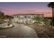 Elegant multi-story home featuring meticulous desert landscaping and lighting at 5427 E Wonderview Rd, Phoenix, AZ 85018