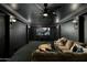 Home theater room with large screen and comfortable sectional sofa at 5427 E Wonderview Rd, Phoenix, AZ 85018
