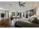 Spacious main bedroom suite with sitting area, fireplace, hardwood floors, and abundant natural light at 5427 E Wonderview Rd, Phoenix, AZ 85018