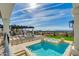 Outdoor pool and spa with lounge chairs and mountain views at 5427 E Wonderview Rd, Phoenix, AZ 85018