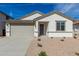 Charming single-Gathering home with stucco exterior, two car garage, and low maintenance front yard at 7226 E Purple Prairie Dr, San Tan Valley, AZ 85143