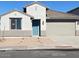 Single-story home with a two-car garage and landscaped front yard at 7276 E Purple Prairie Dr, San Tan Valley, AZ 85143