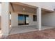 A covered patio with sliding glass door access to the home at 7276 E Purple Prairie Dr, San Tan Valley, AZ 85143