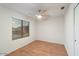 Well-lit bedroom with wood flooring and ceiling fan at 7447 E Christmas Cholla Dr, Scottsdale, AZ 85255