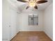 Bright bedroom with wood flooring and ceiling fan at 7447 E Christmas Cholla Dr, Scottsdale, AZ 85255