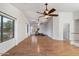 Versatile bonus room with hardwood floors and ceiling fan at 7447 E Christmas Cholla Dr, Scottsdale, AZ 85255