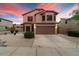 Two-story house with a landscaped yard and a two-car garage at 7447 E Christmas Cholla Dr, Scottsdale, AZ 85255