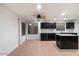 Spacious kitchen with dark cabinets and granite countertops at 7447 E Christmas Cholla Dr, Scottsdale, AZ 85255