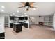 Kitchen with dark cabinetry, granite countertops, and an island at 7447 E Christmas Cholla Dr, Scottsdale, AZ 85255