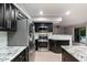 Granite countertops and stainless steel appliances in this kitchen at 7447 E Christmas Cholla Dr, Scottsdale, AZ 85255