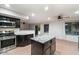 Kitchen with stainless steel appliances and granite island at 7447 E Christmas Cholla Dr, Scottsdale, AZ 85255