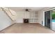 Living room with a fireplace and built-in shelving at 7447 E Christmas Cholla Dr, Scottsdale, AZ 85255