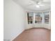Bright and airy living room with tile floors and bay windows at 7447 E Christmas Cholla Dr, Scottsdale, AZ 85255