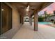 Covered patio overlooks the sparkling pool at 7447 E Christmas Cholla Dr, Scottsdale, AZ 85255