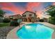 Inviting backyard oasis with a sparkling pool and basketball court at 7447 E Christmas Cholla Dr, Scottsdale, AZ 85255