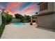 Inviting kidney-shaped pool in backyard oasis at 7447 E Christmas Cholla Dr, Scottsdale, AZ 85255