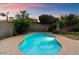 Relaxing kidney shaped pool at sunset at 7447 E Christmas Cholla Dr, Scottsdale, AZ 85255