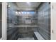 Modern shower with glass enclosure and gray tile at 7447 E Christmas Cholla Dr, Scottsdale, AZ 85255